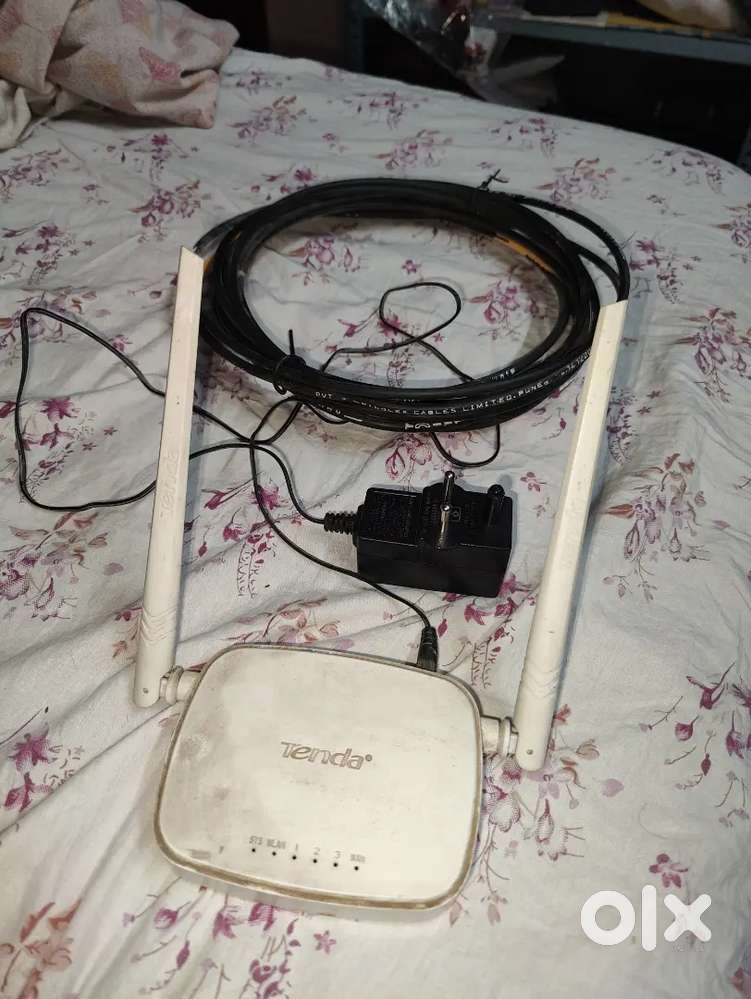 Tenda n300 router with adapter and lan wire