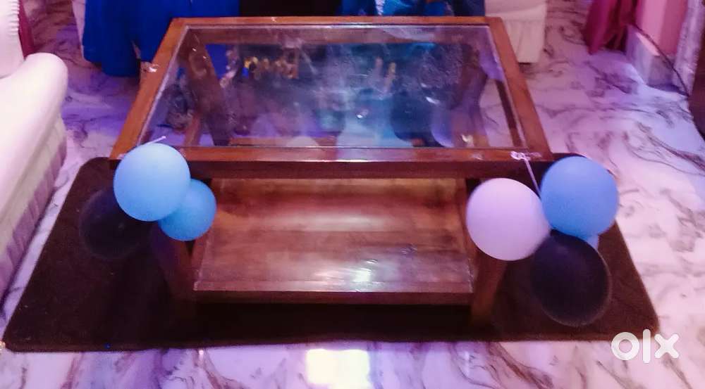 A wooden new tea table with glass