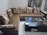 6 seater sofa set with table and puffy