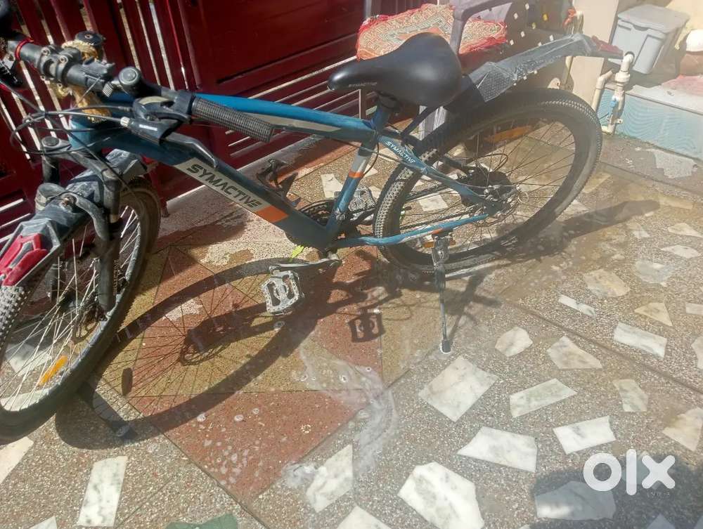 Cycle ka name Symactive S2000 hai 26 inch shimano gear Tourney 21