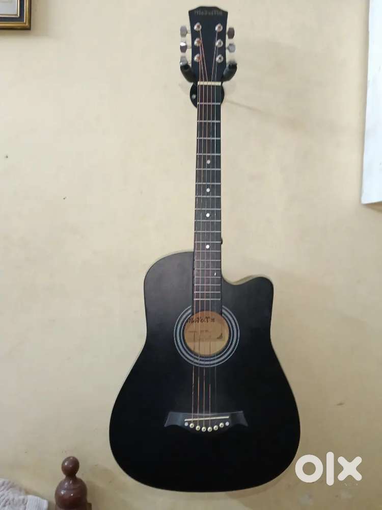 This is very good condition black colour beautiful guitar