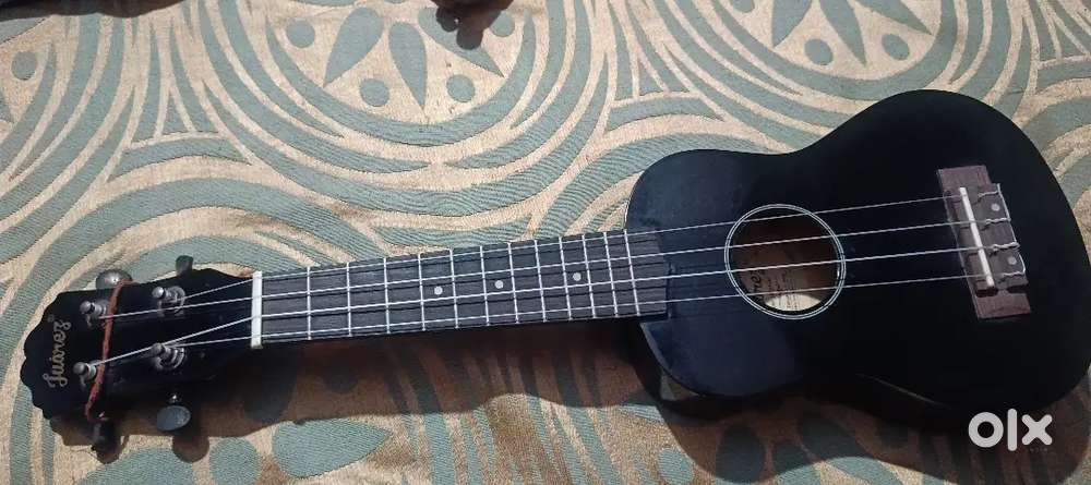 Ukulele 1 year old black colour good condition
