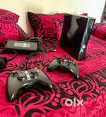 Xbox 360 along with 4 game CDs