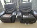 Rocking brown leather sofa