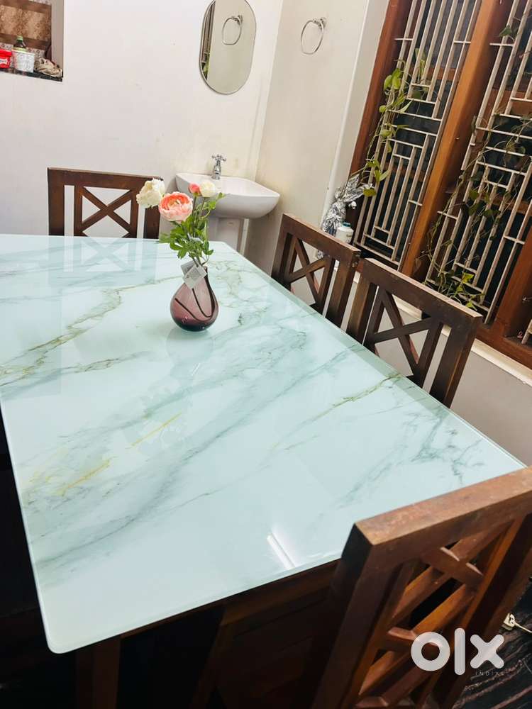 Glass top dining table