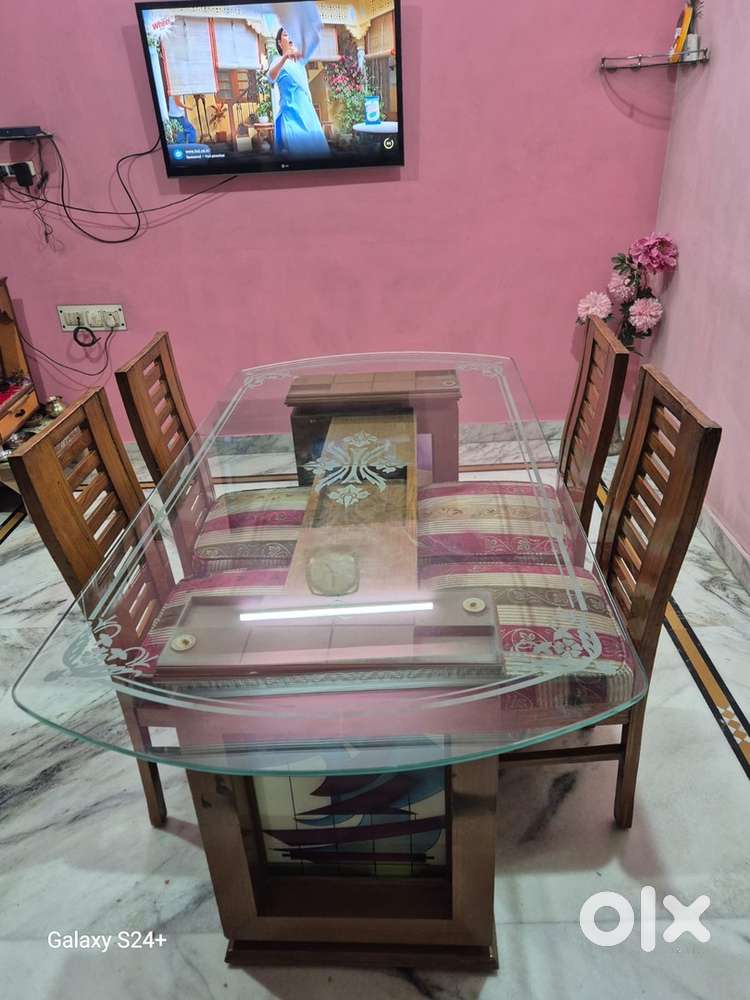 Well Maintained Glass Top with 4 Sagon wood Chairs