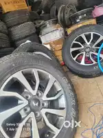 Scorpio' n original mahindra alloy wheels sat of 4 with brand new tyre