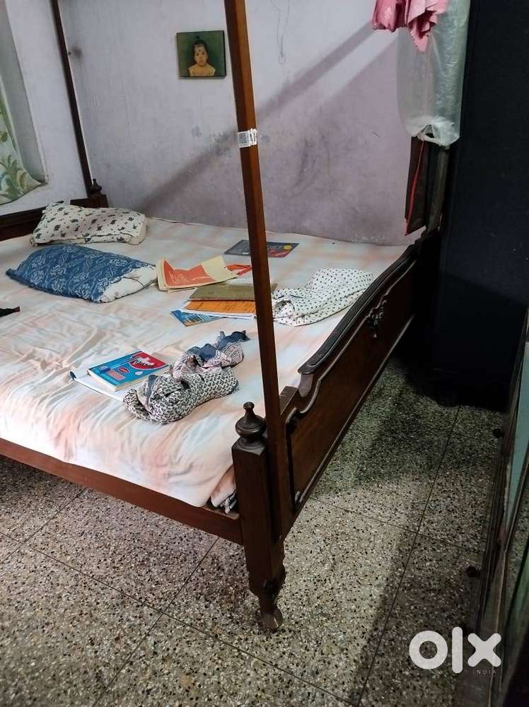 Wooden bed with mattress