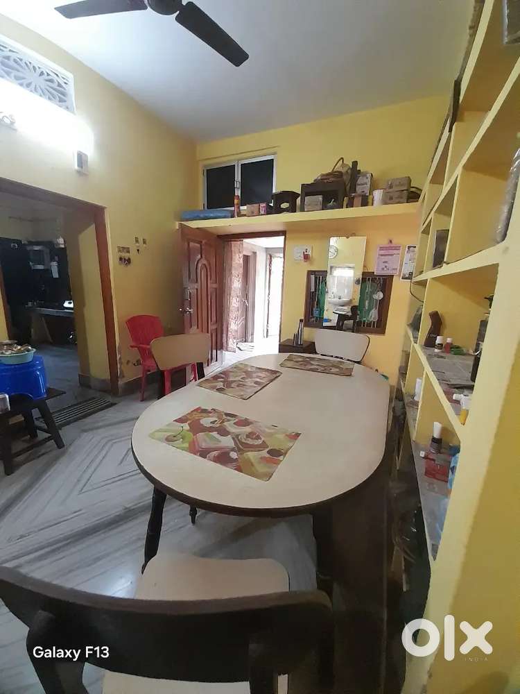 Wooden Dining Table, With Three chairs.