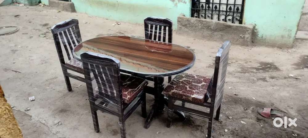 4 seater dining table set with round table brown colour in STARF FURNI