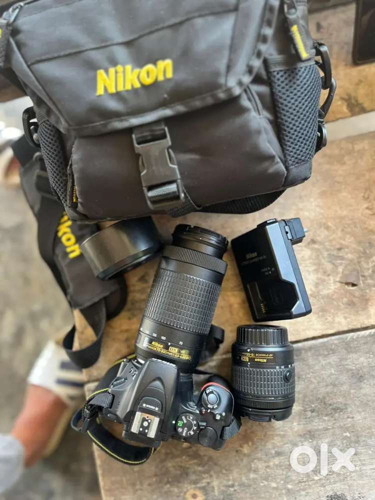 It is a screen touch camera with 18-55 and 70-300 mm lens Argent money