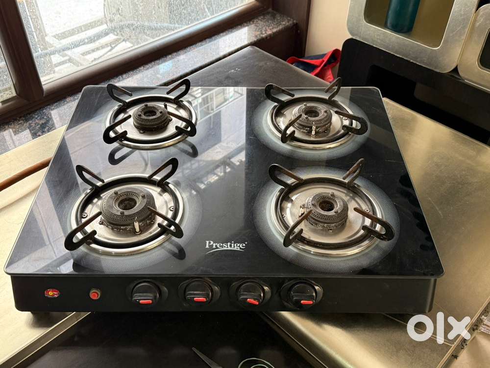 Prestige 4 burner with automatic and Faber kitchen chimney.