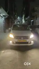 Ertiga gadi theke pe deni hai