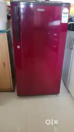 A beautiful maroon 170 litre refrigerator of Haier.