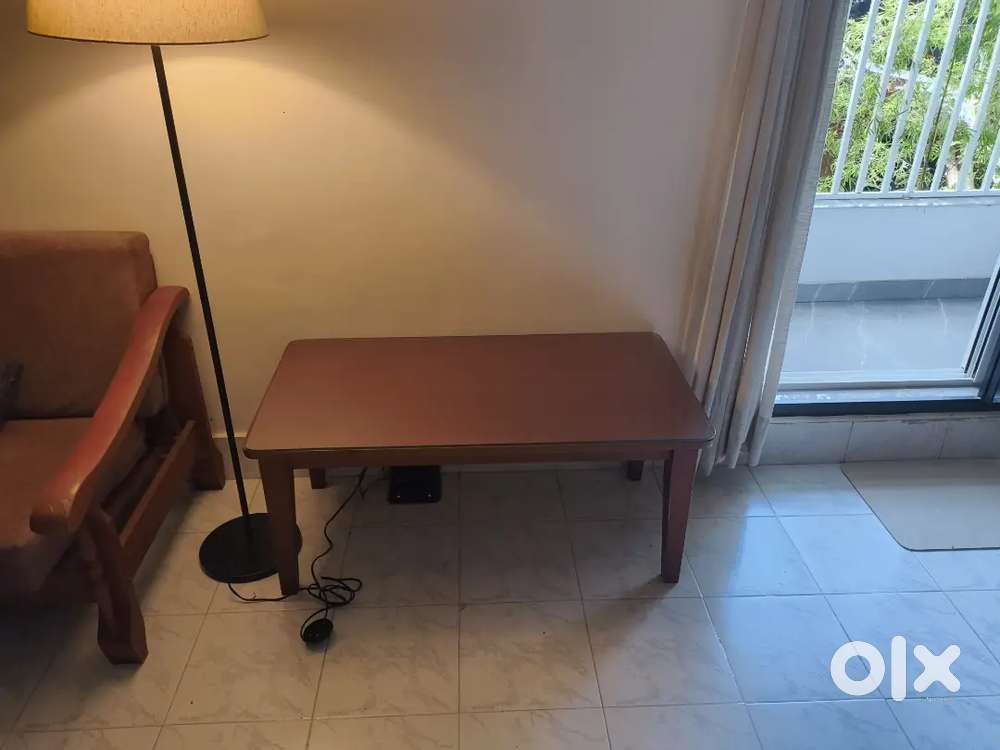 Wooden table with glass top