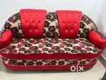 Red coloured sofa