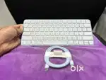 Apple Magic Keyboard with its USB-C to Lightning cable. Magic Keyboard