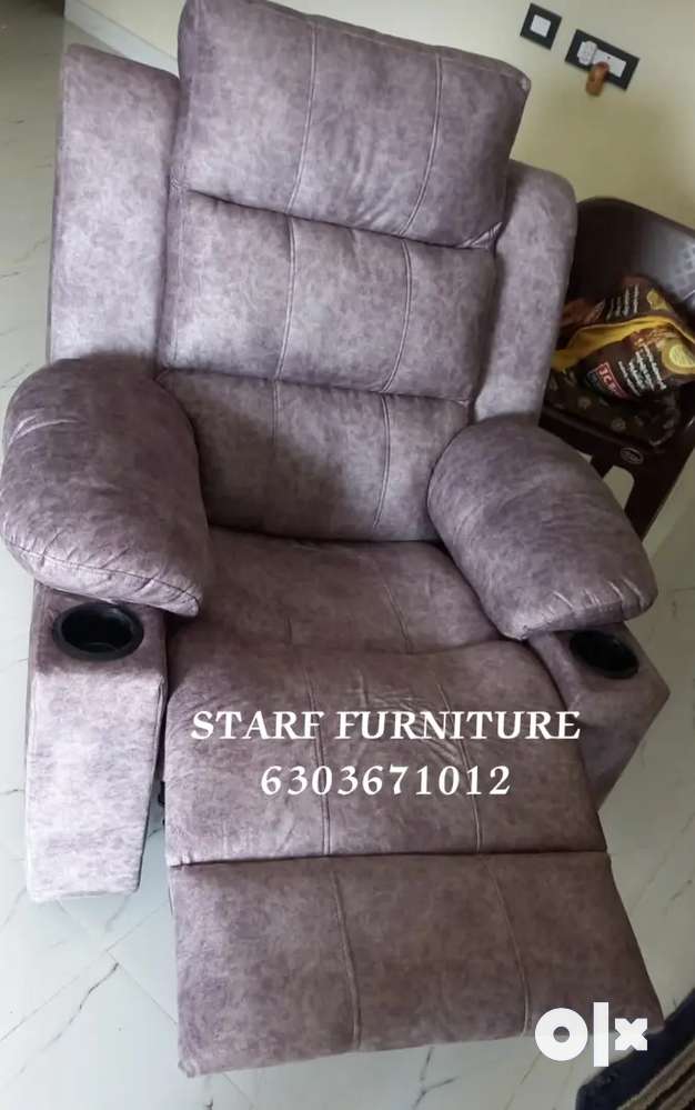 Manual recliners chair with cup holder available in Starf Furniture