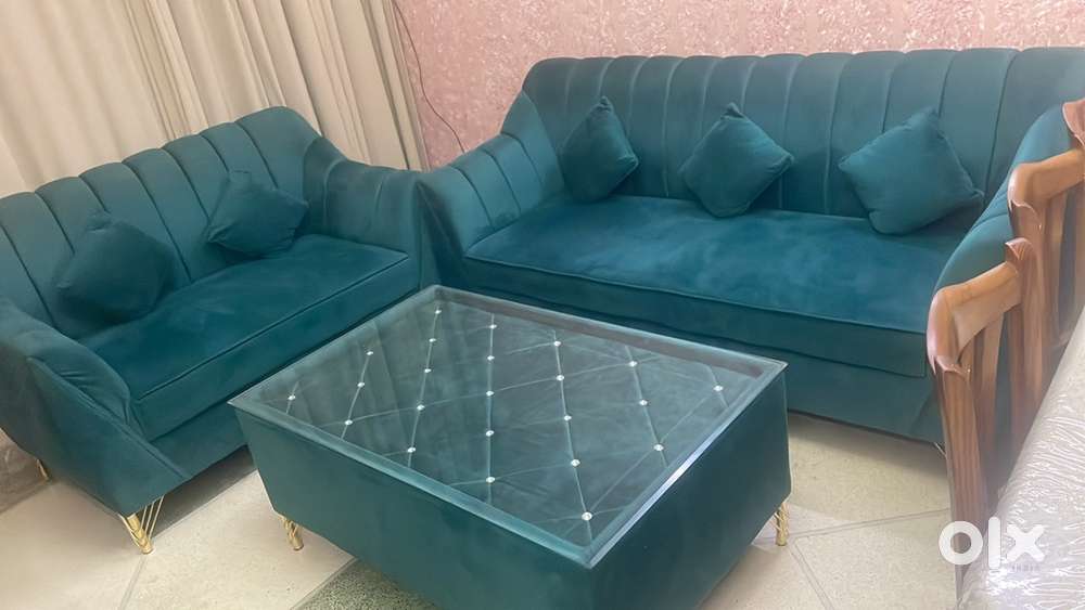 A Five Seater 1 year 4 months old sofa with center Table set