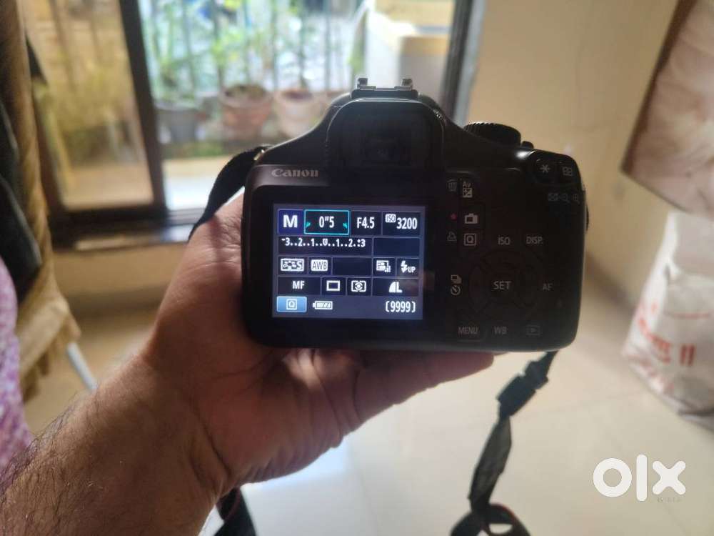 Canon EOS 1100D with lens and bag