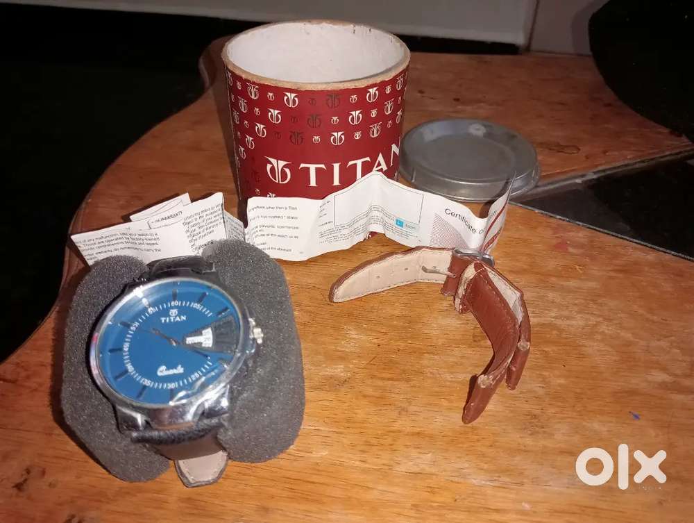 Titan watch with box and certificate of authenticity