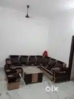 L shape sofa set with pillows and sofa cover