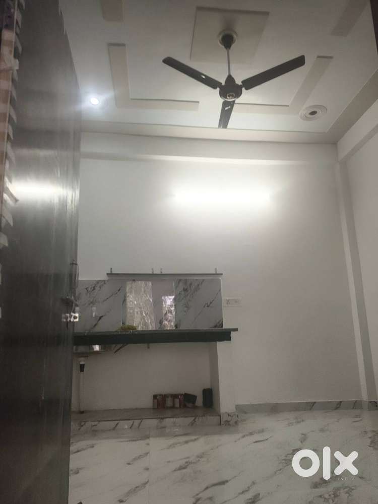 One room set with attached bathroom and kitchen