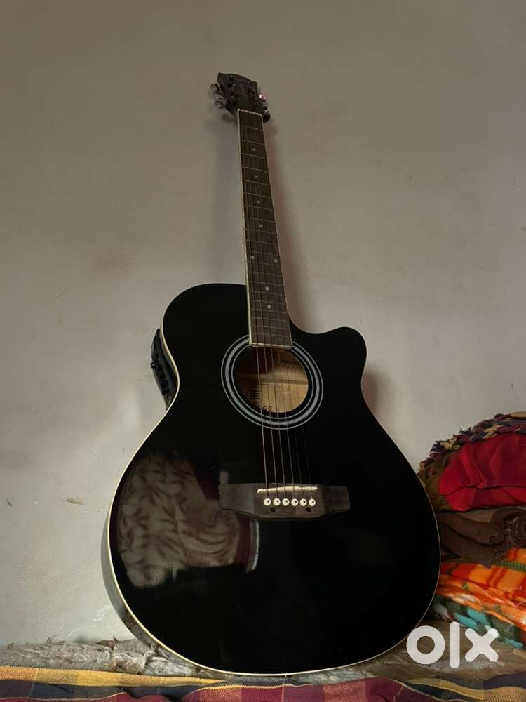 Beginner semi-acoustic guitar.