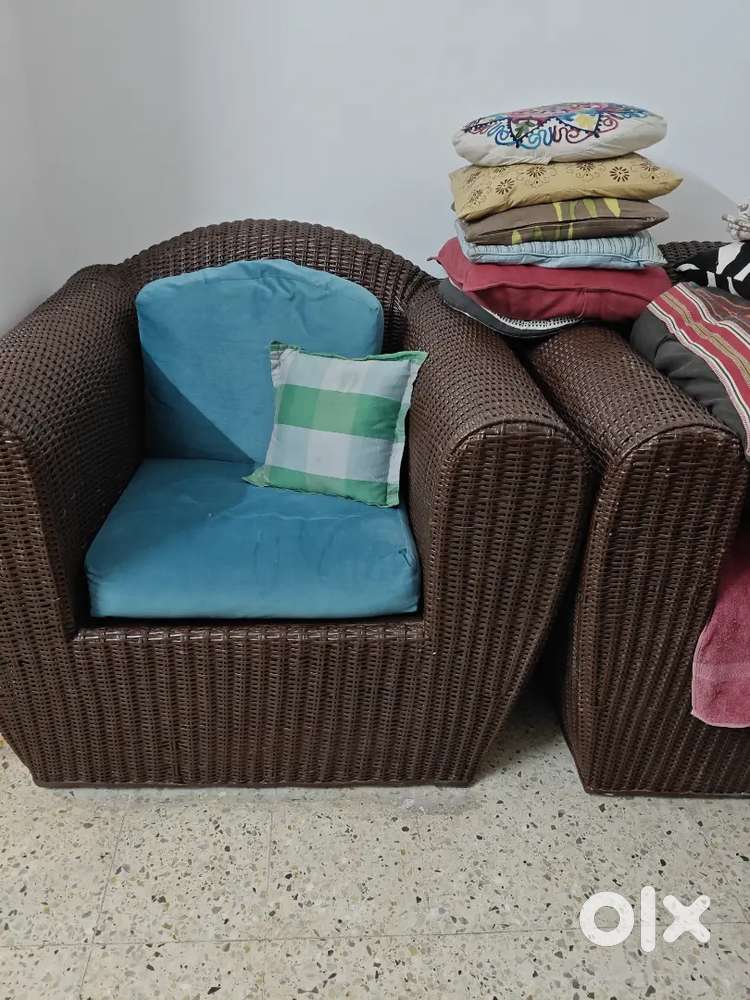 Two single cane sofa with cushions