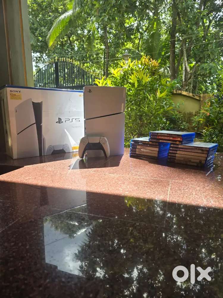 PlayStation 5 slim disk edition with 15 game discs.