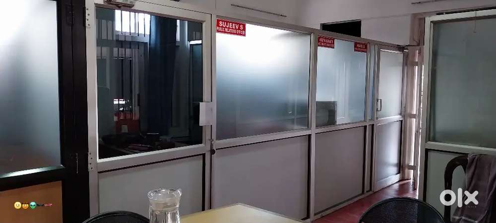 Office area of 600 sqft with cabinets and tables