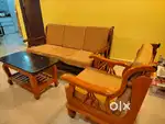 Sagwan wood sofa with center table  in good condition.