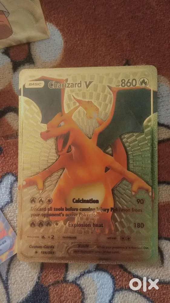 Golden Charizard card and normal Charizard card