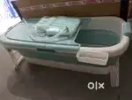 A bathtub ( Dimensions

150L x 62W x 50H Centimeters)
