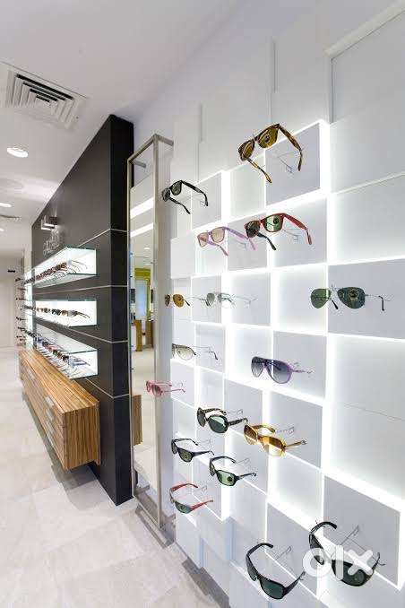 Male / Female Sales Staff at Branded Optical Showroom
