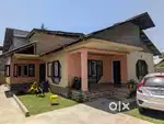 16 Marla Corner Plot with a Spacious Single Story House & 2 Big Shops