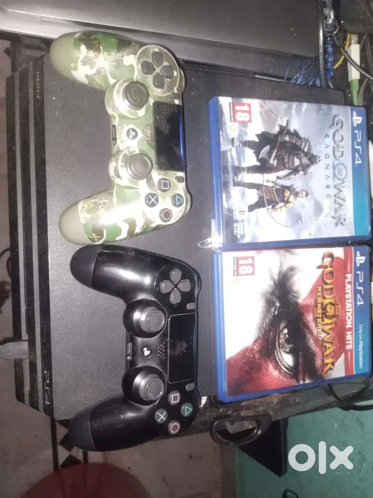 PS4 Pro 1tb with two controllers and cds