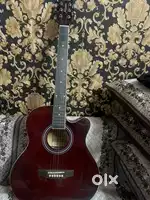 Accoustic guitar in brand new condition in red colour