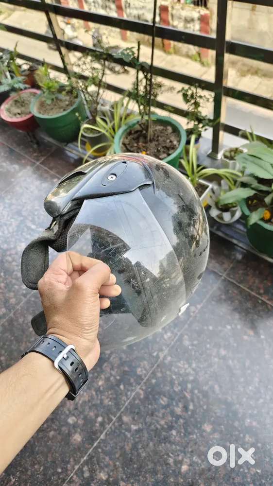 Helmet with straps and shield