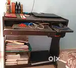 Tabe with keyboard holder mouse space and locker