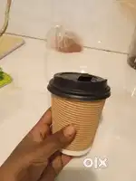 Disposable ripple paper cups with lid.