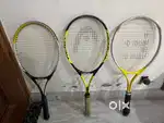A pair of 3 tennis  rackets