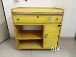 Computer table with storage on trolley-wheel