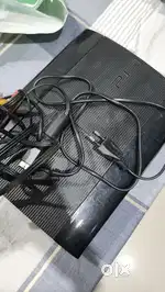 PS3 Slim with Controller and 7 CD Games