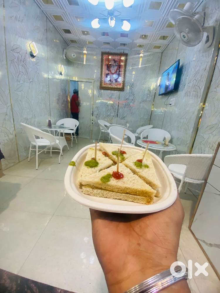 Running cafe for sale with cart and sitting area