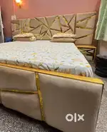 double bed with designer back board and side table
