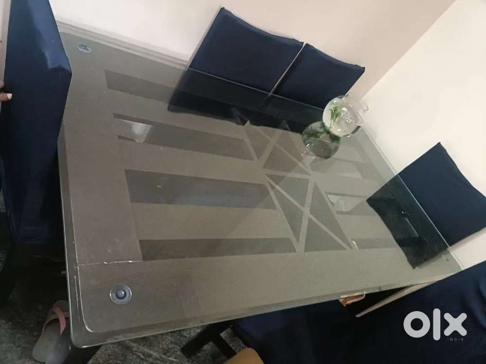 6 seater dininig table with glass top.