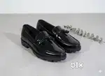 Sleek black patent loafers - stylish, perfect for any occasion!