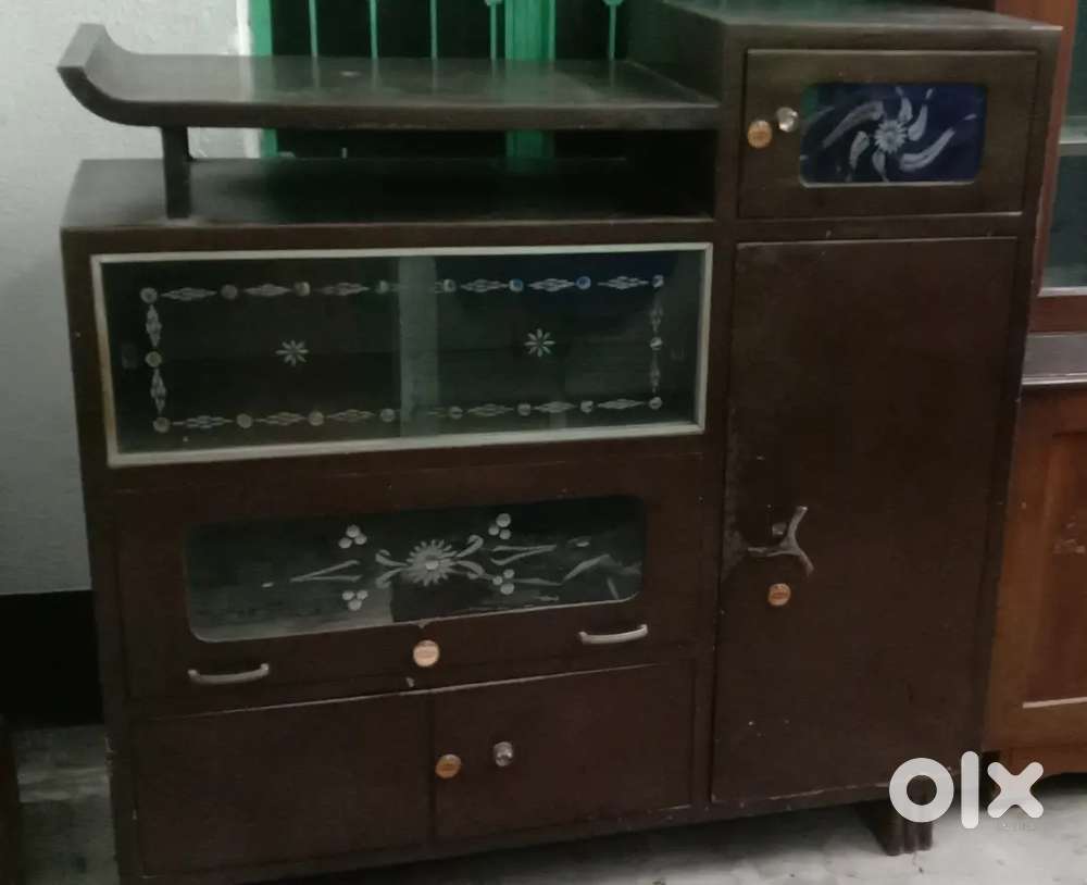 A very beautiful showcase and a door and a dining table