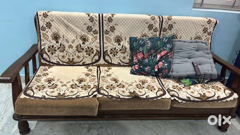Wooden sofa with cushion